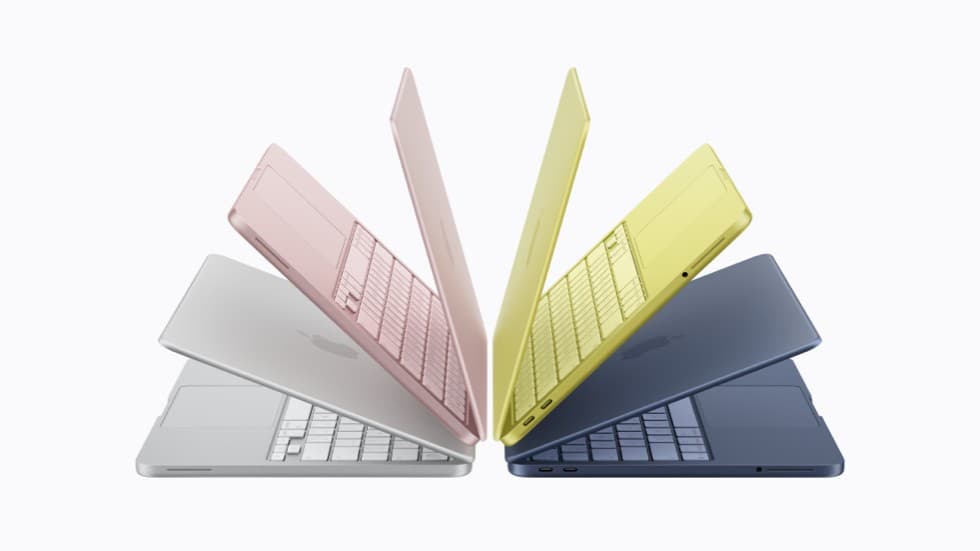 Fire MacBook Neo-enheter vises i fargene sølv, svak rosa, sitrus og indigo.